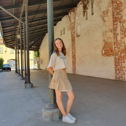 Gonna con tasche e frange beige